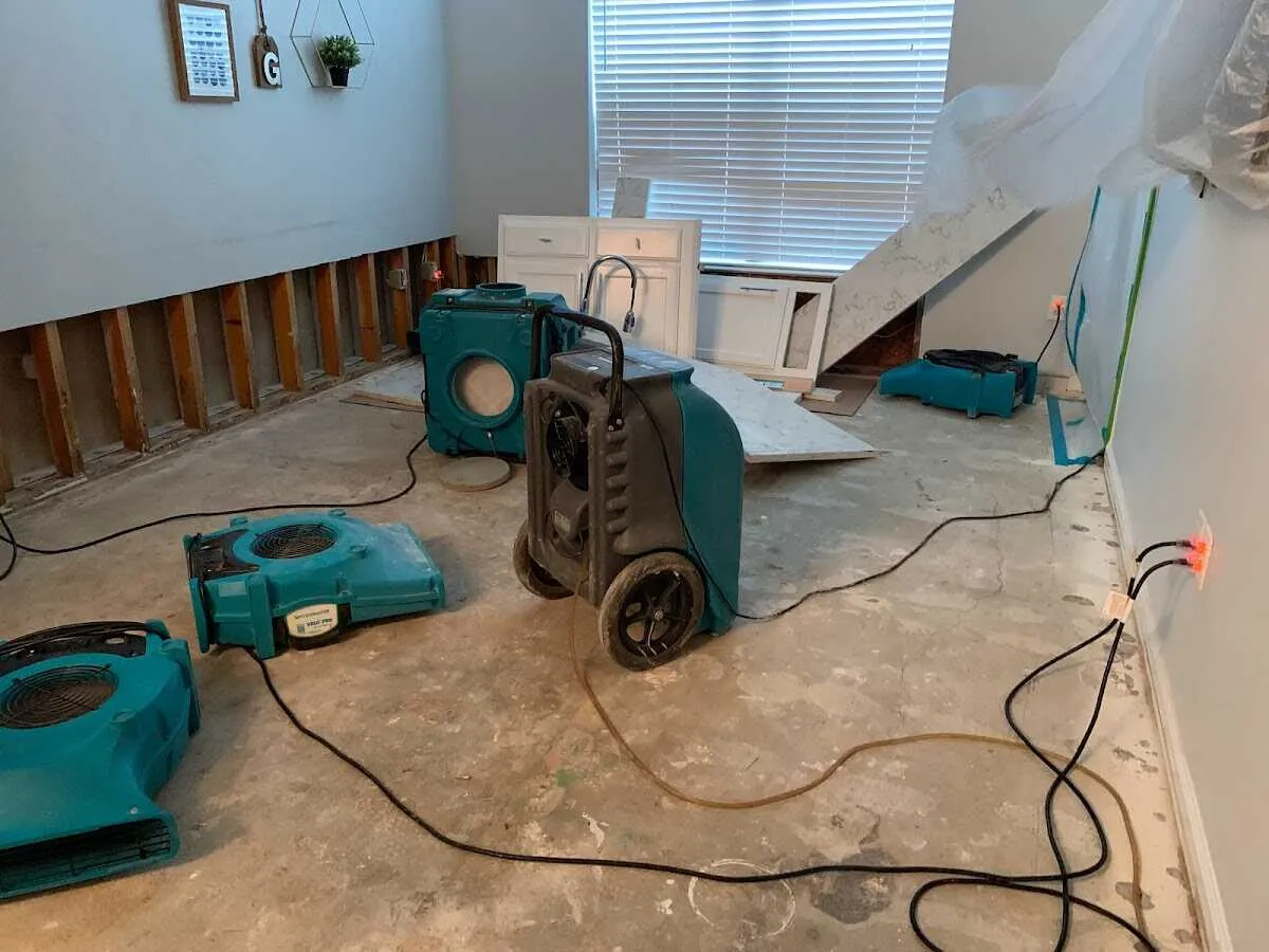 Dehumidifier in flood-cut room for Water Damage Restoration in Buckley